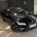 10 Years Old Skoda Laura Restored with Customised Interior & Porshe’s Jet Black Paint