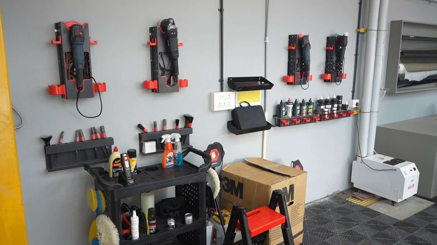Prep bay with sanding machines and dust extractors